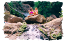 girls on rock at waterfalls