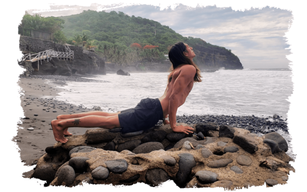 manuel doing yoga on the beach